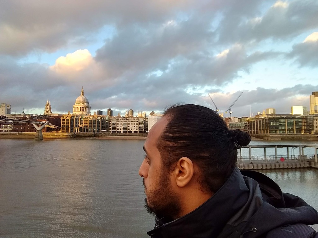 Mosab standing on one of London's bridges
